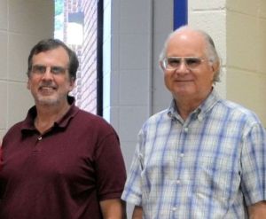 Robert Chaney, left, and Fred Thomas began working out their ideas for simple machines to teach math and science concepts as part of the Sinclair Community College faculty team developing curricula for the Dayton, Ohio, college's ATE manufacturing center in the 1990s. This photo was taken at a Learning with Math Machines Inc. workshop in 2013.   