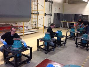 Wind energy technology students at Laramie County Community College work on yaw motors, the AC induction motors with planetary gears that turn turbines into the wind so they produce maximum electric energy.