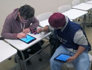 McHenry County College students Joseph Ignoffo and Alex Garcia work with snap cubes during a spatial visualization skills workshop. 