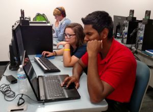 Navneel Dutt and other Clark State Community College interns work through cybersecurity challenges during a Hack-a-Thon in the summer of 2016. 