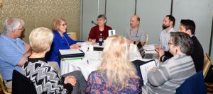 Ann Beheler, far left, leads a discussion with her Mentor-Connect mentees during a workshop. Pamela Silvers, a Mentor-Connect fellow,  is seated to right of Beheler, who is the principal investigator of the National Convergence Technology Center.