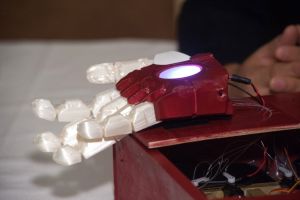 City Tech students created the myoelectric prosthetic hand using a 3-D printer and multiple computer hardware components and software programs.   (Photo by James Tkatch)   