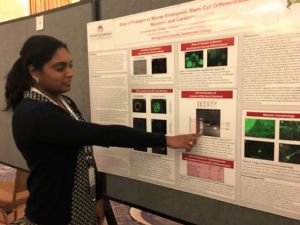 Seethal Meda, a graduate of the biotechnology certificate program at Montgomery County Community College, points to test results confirming deletion of the frataxin gene during a process she conducted for her research internship. 