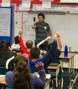 STEM TP2 student Jonah Veliz, as part of his UC Irvine Introduction to Teaching Math and Science course, leads a math lesson for fifth graders at Workman Avenue Elementary School in West Covina, CA. 