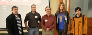 Brookdale Professor Michael Qaissaunee (center) with his networking students at NJ Governor's Cyber Security Challenge.