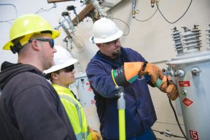 Instructor demonstrating transformer connections to students