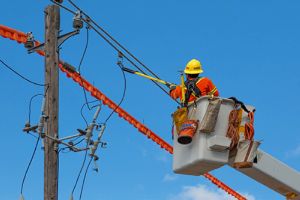 Line apprentice working on electrical wires