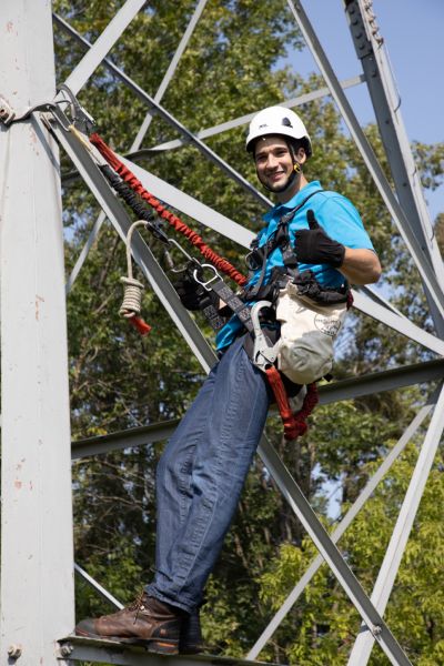 student climbing cell phone tower